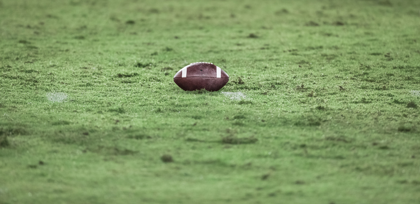 American football on football field