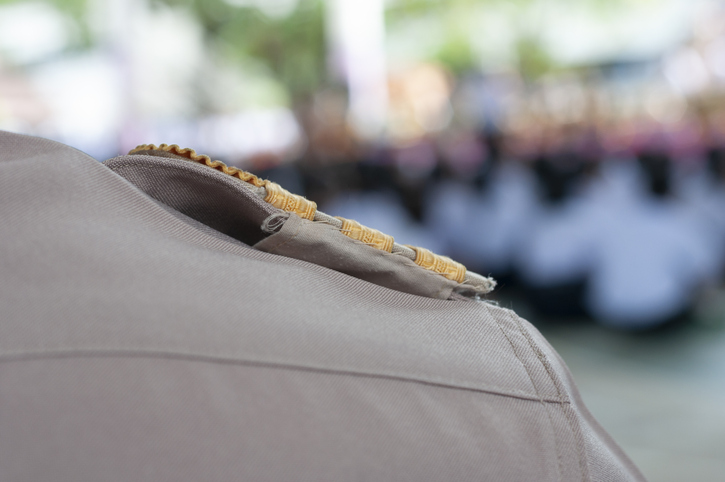 Close-Up Of Person With Badge On Shoulder